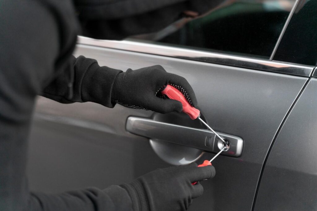 close up man trying break into car (1)
